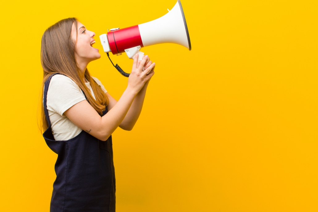 Crisis communication header image of girl speaking through megaphone