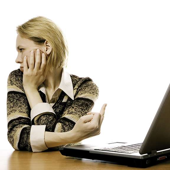 Female reacting with finger to laptop thanks in advance