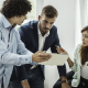 giving constructive feedback image of business team communicating