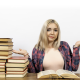 image of a young lady with books holding her hands up as a gesture to say, "which one" for teh article on advice.